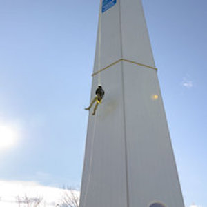 NLC Training tower at Dawson Creek with student repelling down