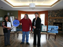 (Left) NLC Aboriginal coordinator Theresa Gladue, artist Marvin Johnson, and NLC president Laurie Rancourt, celebrate the artist’s donation to the College’s Dawson Creek campus Aboriginal Gathering Space.