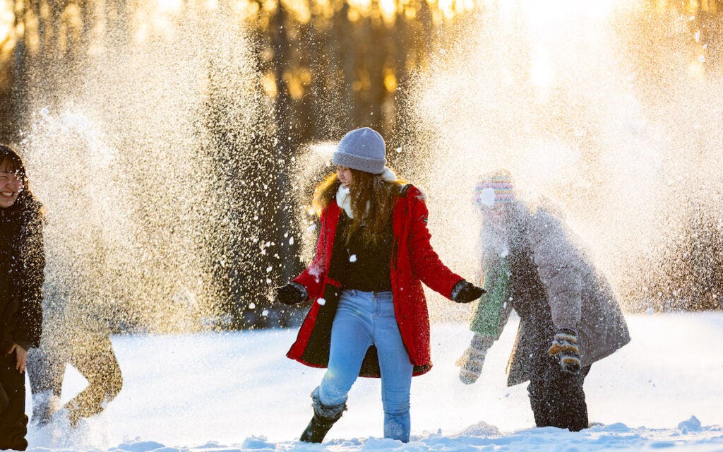 3 people having a snowball fight