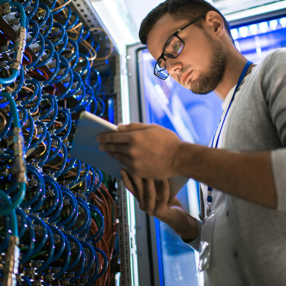 Young man looking at server