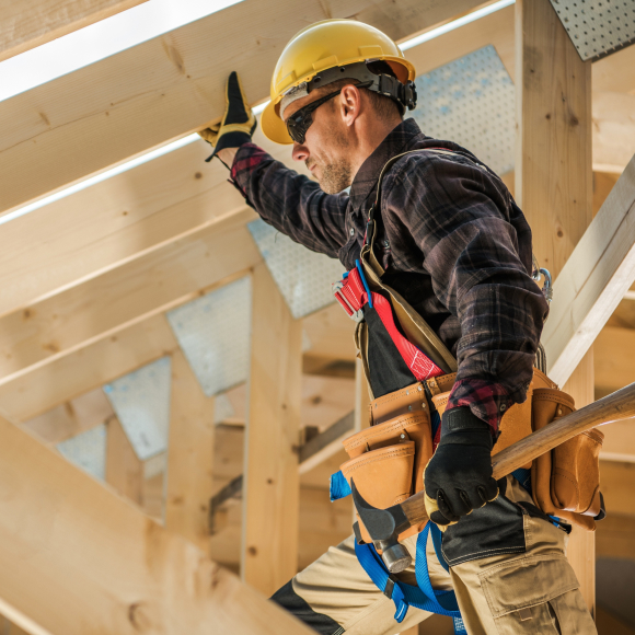 Trades person inside building that is under construction