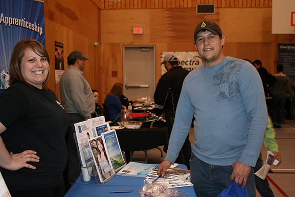 NLC student recruiter lead Courtenay Chisholm and welding student Paddy Courtoreille at the March 28 education and career fair in Moberly Lake.