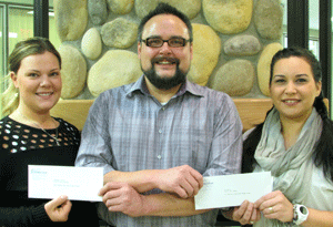 Brittany Lequiere (left) and April Davis received the
Talisman Aboriginal New Student Award from
Fort St. John Aboriginal Student Advisor
David Christie.