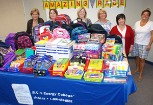 Allyson Hayes (right) of SPCRS accepted a 
table full of school supplies collected by staff 
at Northern Lights College. Presenting the 
supplies on behalf of NLC were President 
Laurie Rancourt, and some of the members 
of the Networks organizing team Holly 
Larden, Anndra Graff, Susan Soutar, 
and Jessie Drew.