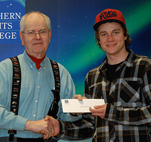 August Lehmann (left) presented the Erich W. Lehmann Memorial Award to LukeLarsen	