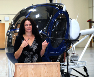 Jody Dwyer, with the Hughes 300 helicopter.
