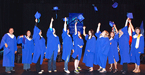 The graduating class fulfills a
traditional celebration with the
post-Convocation hat toss.