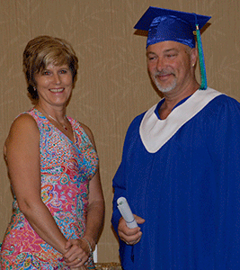 Alain Bourdeau, an Oil and Gas Field
Operator program graduate, received
his credential from NLC Board Chair Karen Simpson