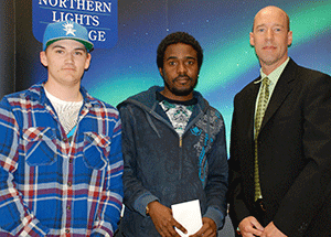  Carson Newby (right) of Shell presented the Canadian Association of Petroleum Producers Scholarship to Logan Piccinin and Taofeek Tejani.