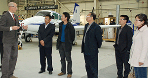 Aircraft Maintenance Engineering program chair Hal Hobenshield led the JTTC delegation on a tour of the hangar at the Dawson Creek Campus. 