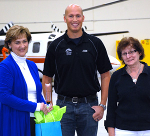 

NLC President Laurie Rancourt (left) and
AME program chair Hal Hobenshield
with Joan Dwyer. 