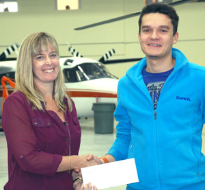 Nick Lesin received the Duane Sunderman
Memorial Award from Dawson Creek
Financial Aid Officer Billie-Jo Crandall.