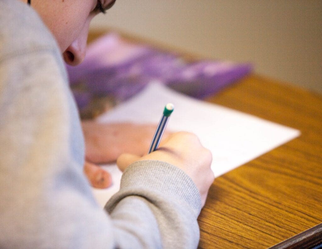 Closeup of student writing an exam